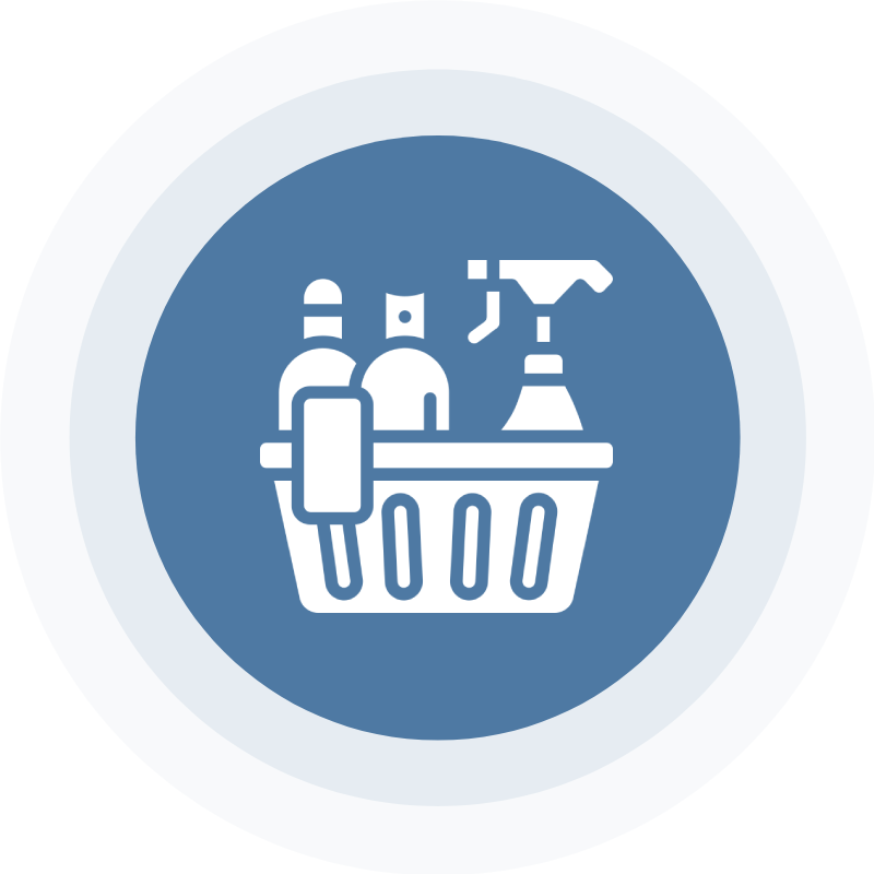 A basket of cleaning supplies on top of a blue circle.